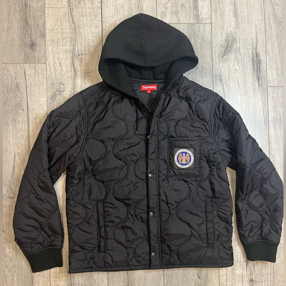 Supreme Black Quilted Hooded Jacket. “I pledge allegiance to shit”. FW17.